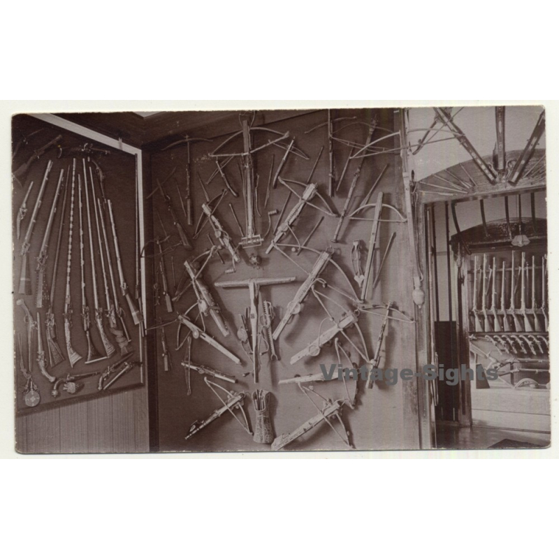 Gun Shop Exhibition: Crossbows, Rifles & Pistols (Vintage RPPC Sepia ~1910s/1920s)