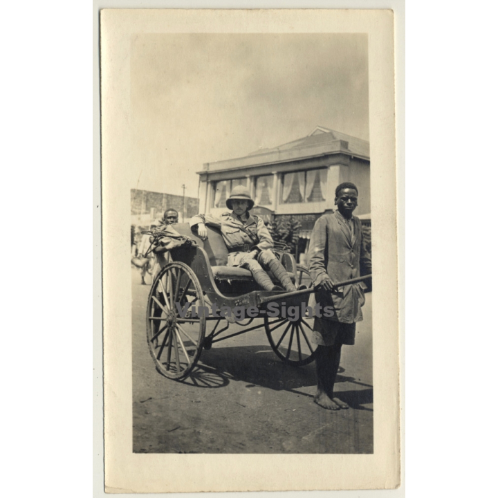 Africa: Colonialist In Rickshaw Pulled By A Native (Vintage Photo 1930s/1940s)