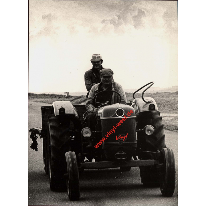 Two Farmers On Tractor