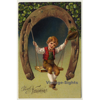 New Year Greetings: Boy On Horseshoe Swing (Vintage PC Germany 1906)