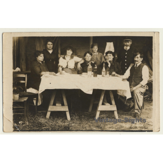 Belgian Family On Table In Barn / Drinks - Bottle (Vintage RPPC 1915)