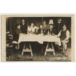 Belgian Family On Table In Barn / Drinks - Bottle (Vintage RPPC 1915)
