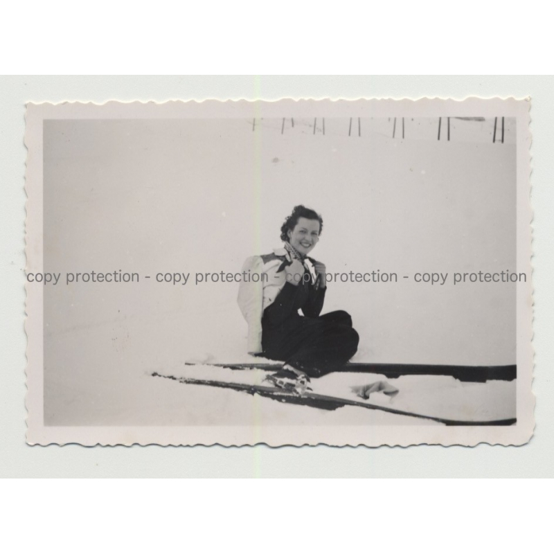 Pretty Girl With Huge Skis Sits In Snow (Vintage Photo Germany 1930s/1940s)