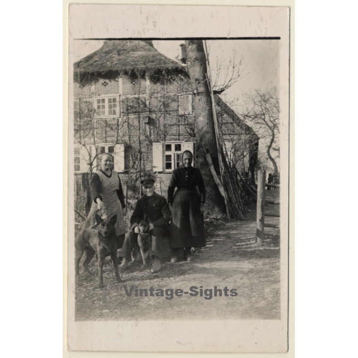 Peasant Family With 2 German Shepherd Dogs (Vintage RPPC ~1920s/1930s)