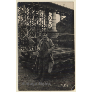 WW1: German Soldier In Front Of Railway Sleepers & Railway Bridge (Vintage RPPC 1915)