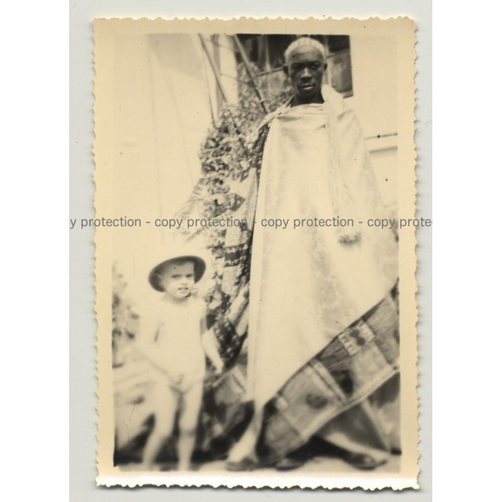 African Man In Traditional Wrapper & White Boy (Vintage Photo B/W Africa ~1940s)