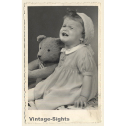 Crying Baby Girl With Big Teddy Bear (Vintage RPPC 1930s/1940s)