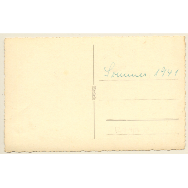 Cheeky Young Woman In Flowered Dress & Teddy Bear On Her Knees (Vintage RPPC 1941)