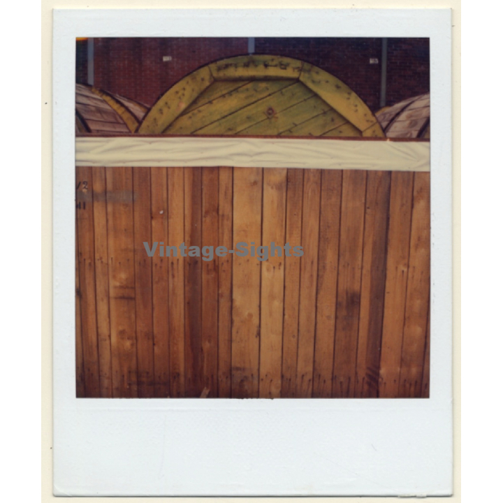 Photo Art: Cable Drum Behind Wood Wall (Vintage Polaroid SX-70 1980s)