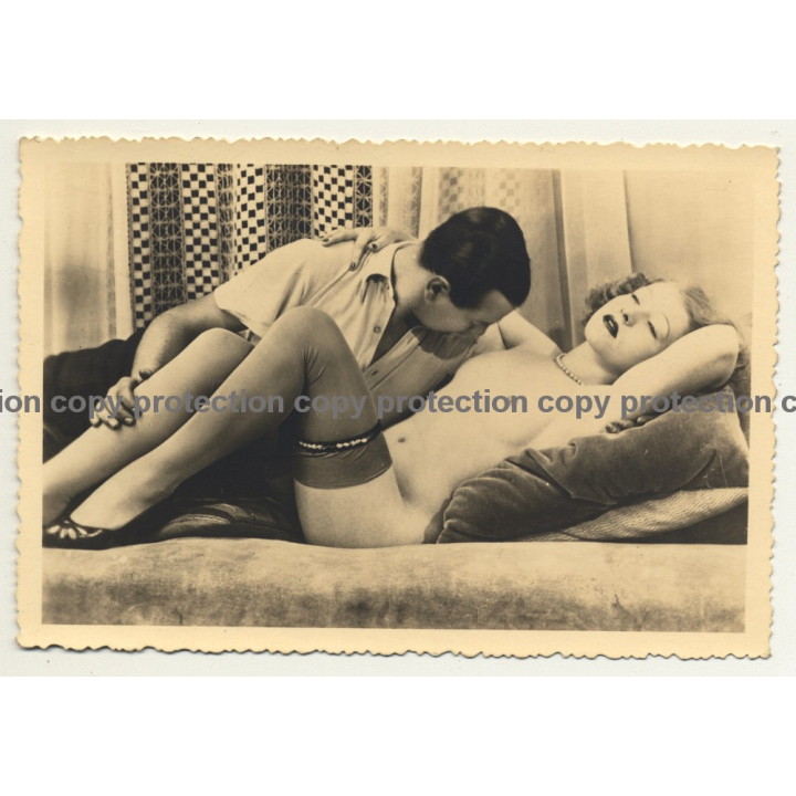 Man Embraces Nude Female On Couch / Stockings (Vintage RPPC B/W ~1920s/1930s)