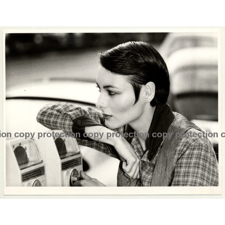 Close-Up Of Woman Leaning Against Parking Meter (Fashion Photo 1980s)