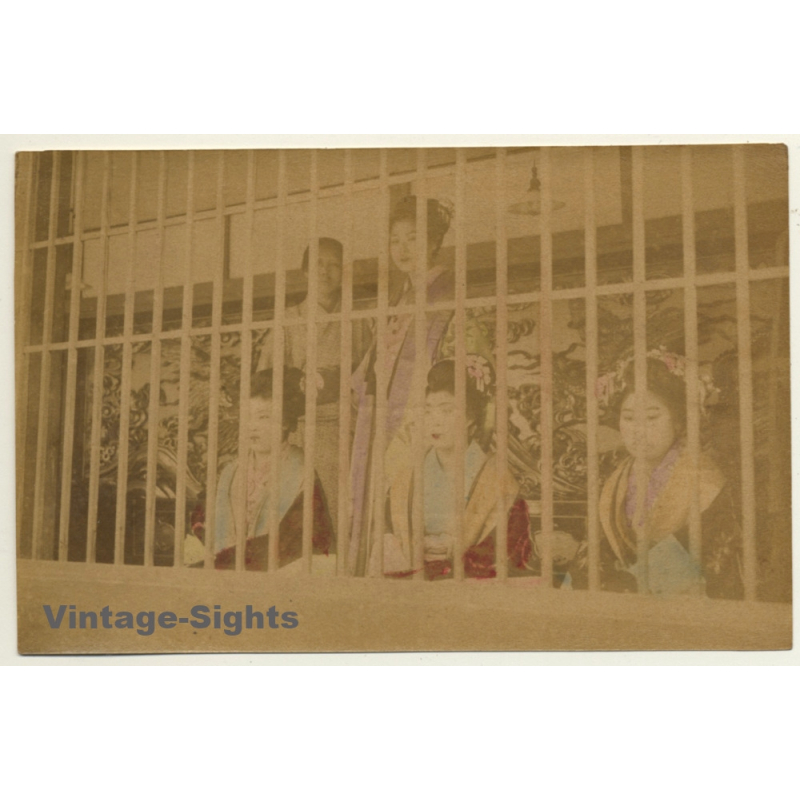 Japan: Yoshiwara Prostitutes Behind Bars - Harimise / Meiji Period (Vintage Hand Tinted Photo ~1890s) Japan: Yoshiwara Prostitutes Behind Bars - Harimise / Meiji Period (Vintage Hand Tinted Photo ~1890s)