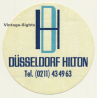 Düsseldorf / Germany: Hilton Hotel (Vintage Self Adhesive Luggage Label / Sticker)