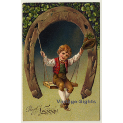 New Year Greetings: Boy On Horseshoe Swing (Vintage PC Germany 1906)