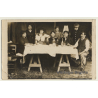Belgian Family On Table In Barn / Drinks - Bottle (Vintage RPPC 1915)