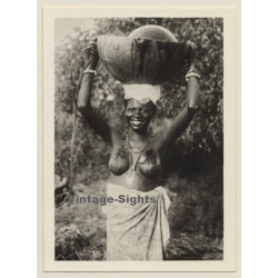Africa: Topless Indigenous Female Head-Carrying (Vintage Photo Print)
