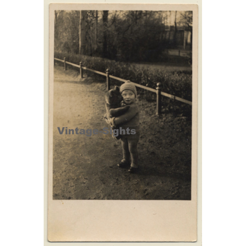Little Baby Girl Embraces Teddy Bear Outdoors (Vintage RPPC 1930s/1940s) Little Baby Girl Embraces Teddy Bear Outdoors (Vintage RPPC 1930s/1940s)