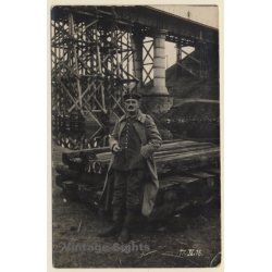 WW1: German Soldier In Front Of Railway Sleepers & Railway Bridge (Vintage RPPC 1915)