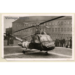 Die fliegende Underberg Flasche / Hubschrauber (Vintage RPPC ~1950s/1960s)