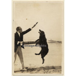 Snapshot: Man Playing With Jumping Dog On Waterfront (Vintage Photo 1922)