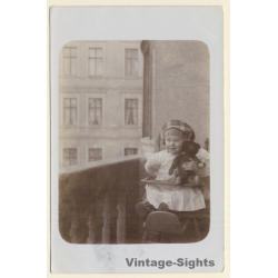 Little Baby Girl On Balcony With Teddy Bear (Vintage RPPC 1912)