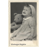 Crying Baby Girl With Big Teddy Bear (Vintage RPPC 1930s/1940s)