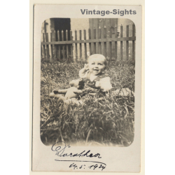 Little Baby Girl & Teddy Bear On Meadow (Vintage RPPC 1924)