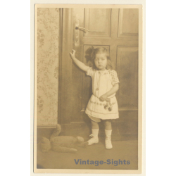 Sulky Little Girl At Door - Teddy Bear On Floor (Vintage RPPC 1920s/1930s)