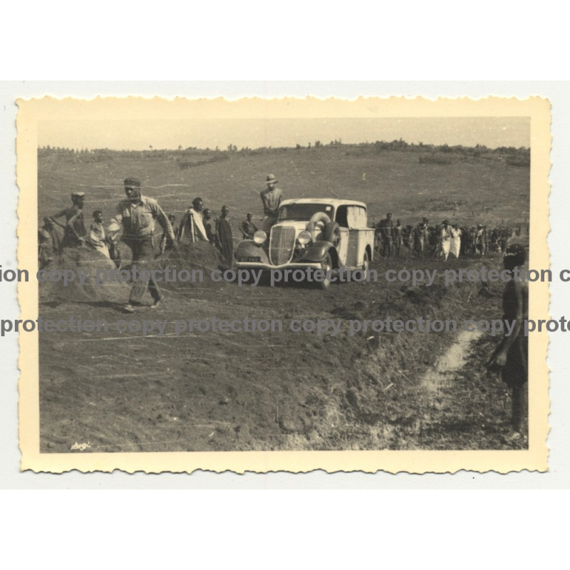 Modificated 1934 Ford Deluxe On Dirty Road / Natives - Congo? (Vintage Photo B/W) Modificated 1934 Ford Deluxe On Dirty Road / Natives - Congo? (Vintage Photo B/W)