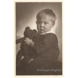 Sulky Baby Girl Holds Her Teddy Bear (Vintage RPPC ~1920s/1930s)